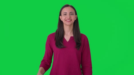 Happy-Indian-woman-waving-Hello-Green-screen