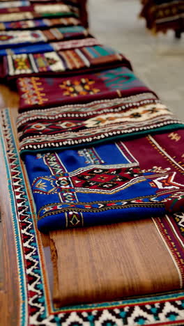 traditional textiles on display at a market