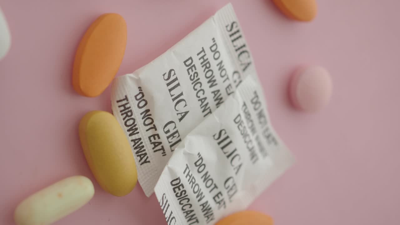 Silica gel packets and colorful pills