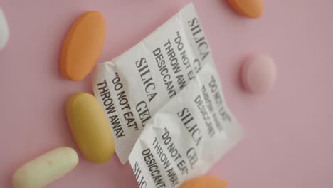 silica gel packets and colorful pills