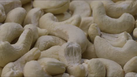 a close and pan view shot of peeled cashew nuts