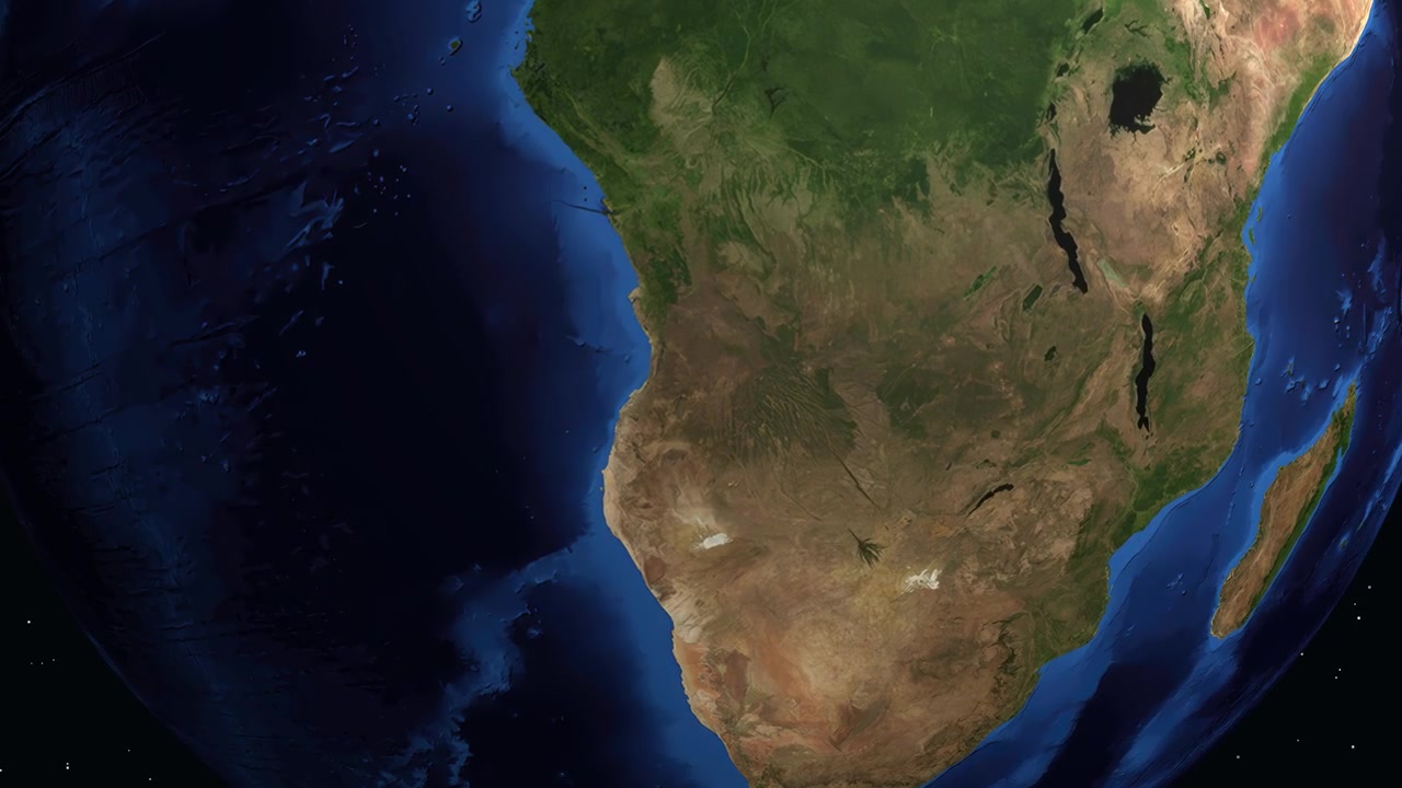 Digital globe rotates and zooms into Huambo, Angola, displaying a data panel with regional statistics