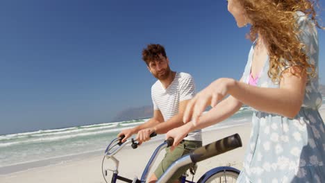 couple interacting with each other at beach 4k