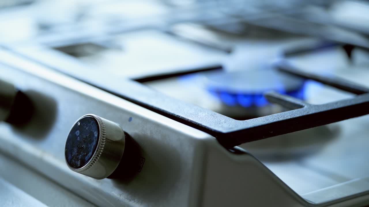 Gas Stove In The Kitchen. Panel from steel with gas ring burner