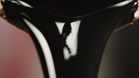 close-up of dark liquid dripping