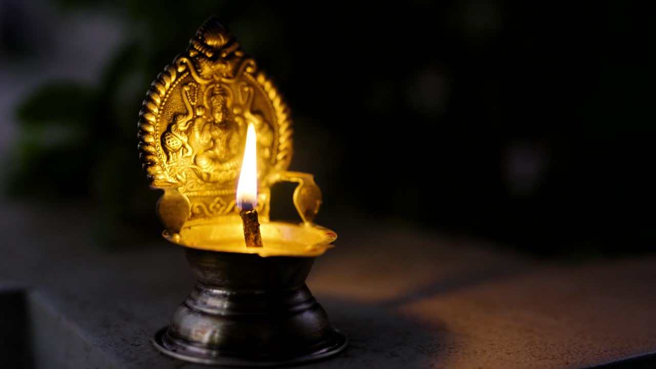 Blowing Out a Diya in the Wind – Spiritual Symbolism, Hindu Spiritual Symbol and Traditional Indian Ritual Concept