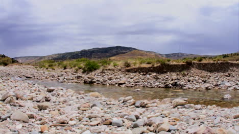 slow pan of a shallow river, mediterranean climate