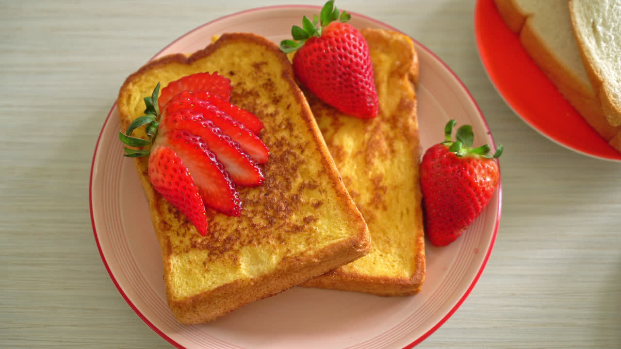 french toast with fresh strawberry on plate