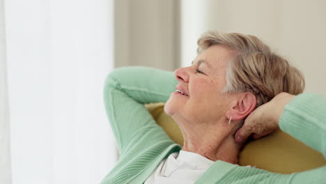 Stretching,-relax-and-senior-woman-on-a-sofa