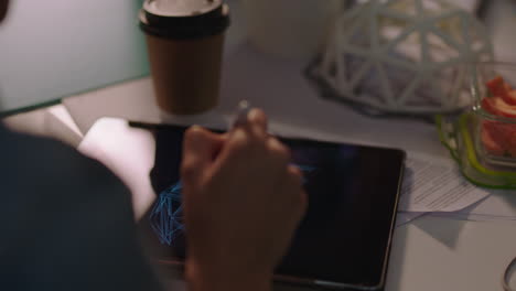 business team working late women engineers design geodesic dome 3d model using tablet computer technology brainstorming in evening office at night