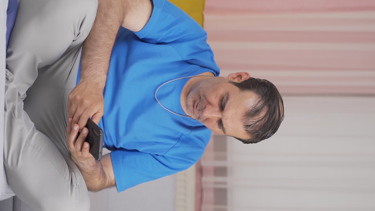 Vertical video of Disappointed man in messaging.