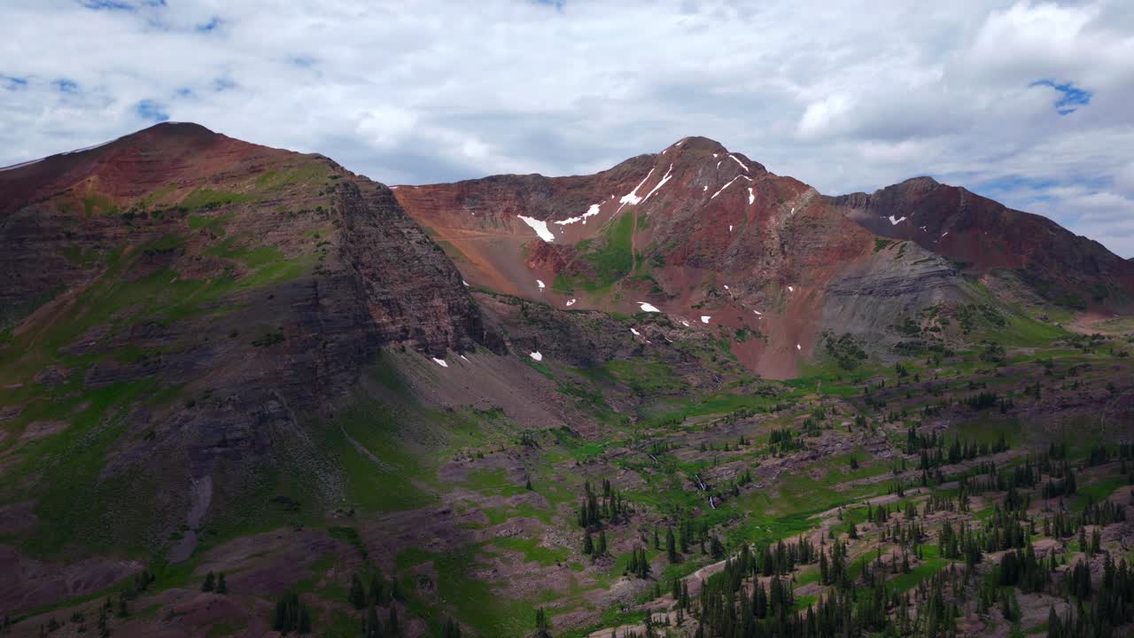 Robinson Basin Ruby Peak Kebler Pass Lake Irwin Trailhead spring summer aerial drone Crested Butte Colorado Gunnison National Forest morning daytime blue sky clouds snow fields zoom in