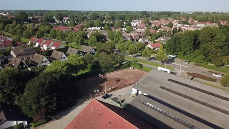 drone view kids riding horses in dronten, flevoland, the netherlands