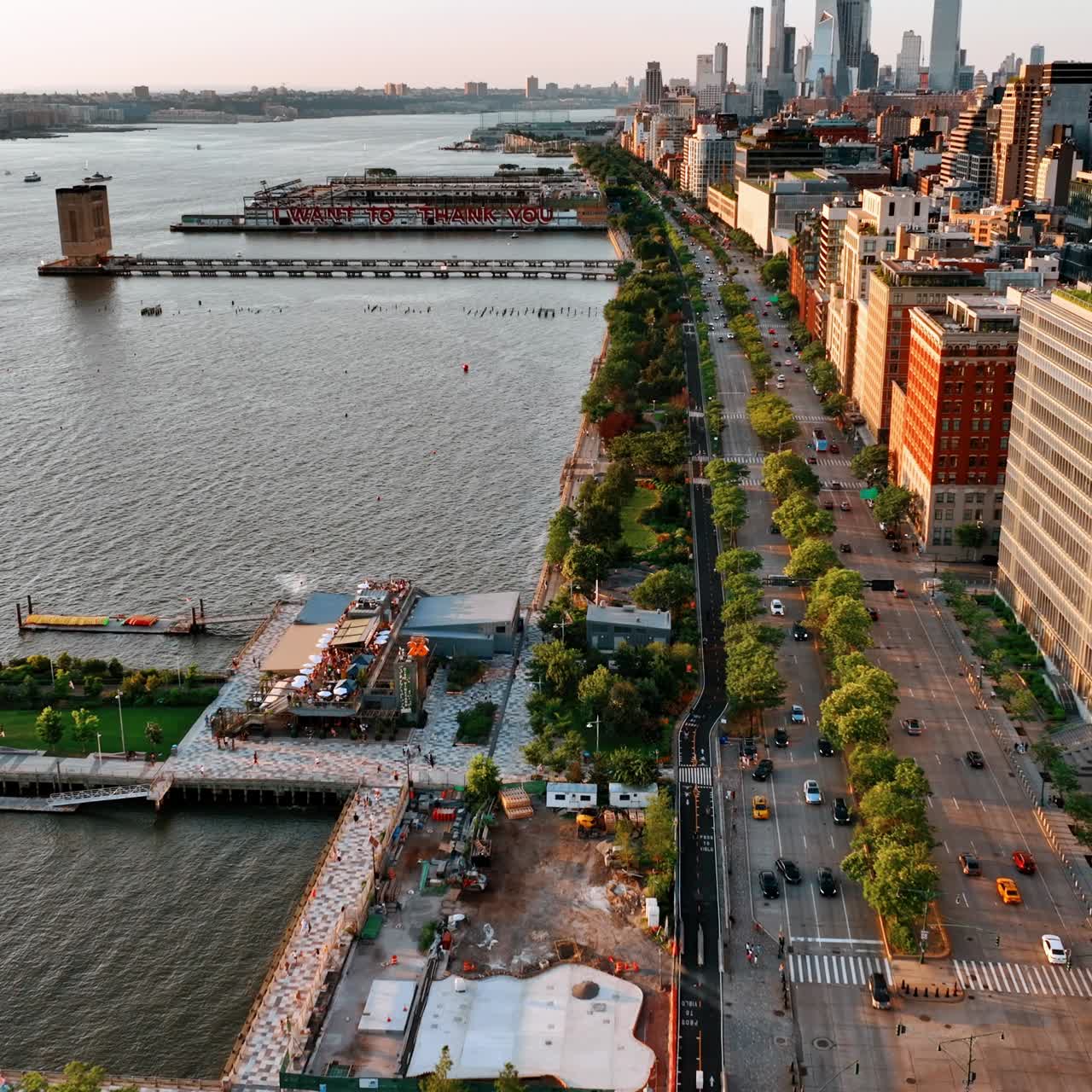 Sight of the lively highway on the river waterfront. View of beautiful New York from aerial perspective