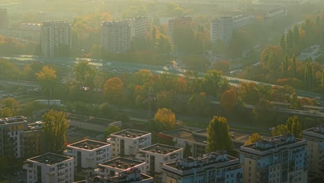 warsaw, poland. aerial view of street traffic and residential buildings on misty autumn morning