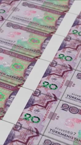 vertical video of 20 turkmenistan manat banknotes printed by a money press