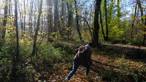man running in trees and bushes