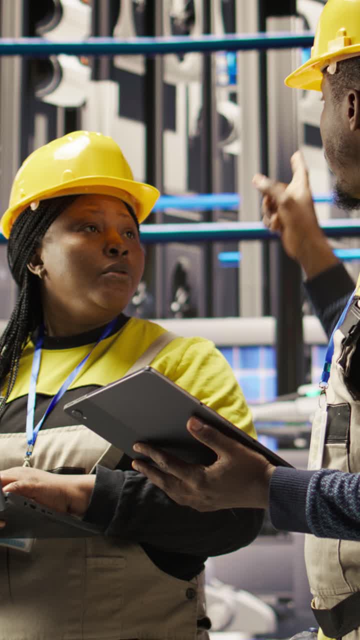 Vertical video Engineering team working together in industry 4.0 plant