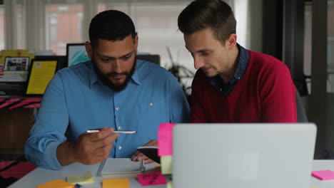 Confident-young-people-working-together-in-office.