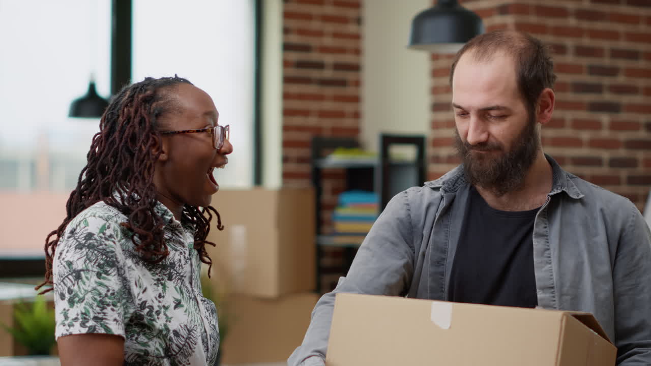 Diverse married couple getting house keys to move in