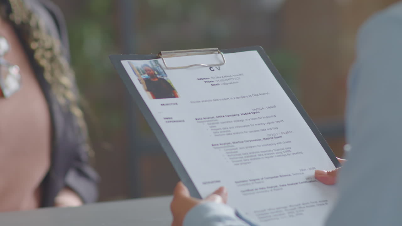Cheerful Black Businesswoman Talking with Recruiter on Job Interview