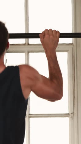 fit man doing some pull ups