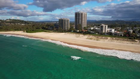 seafront hotels of palm beach coastal suburb in the city of gold coast, queensland, australia. aerial drone shot