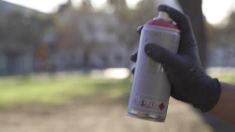 Slow-motion-shot-of-person-spraying-red-spray-paint-into-air---Environmental-Pollution-of-earth---Toxic-gases-in-nature