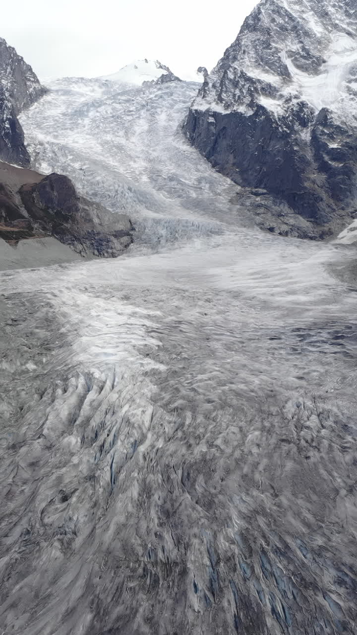 Aerial View of a Massive Glacier in the Alps