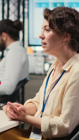 vertical video employees sharing ideas on a web video conference call at the workstation