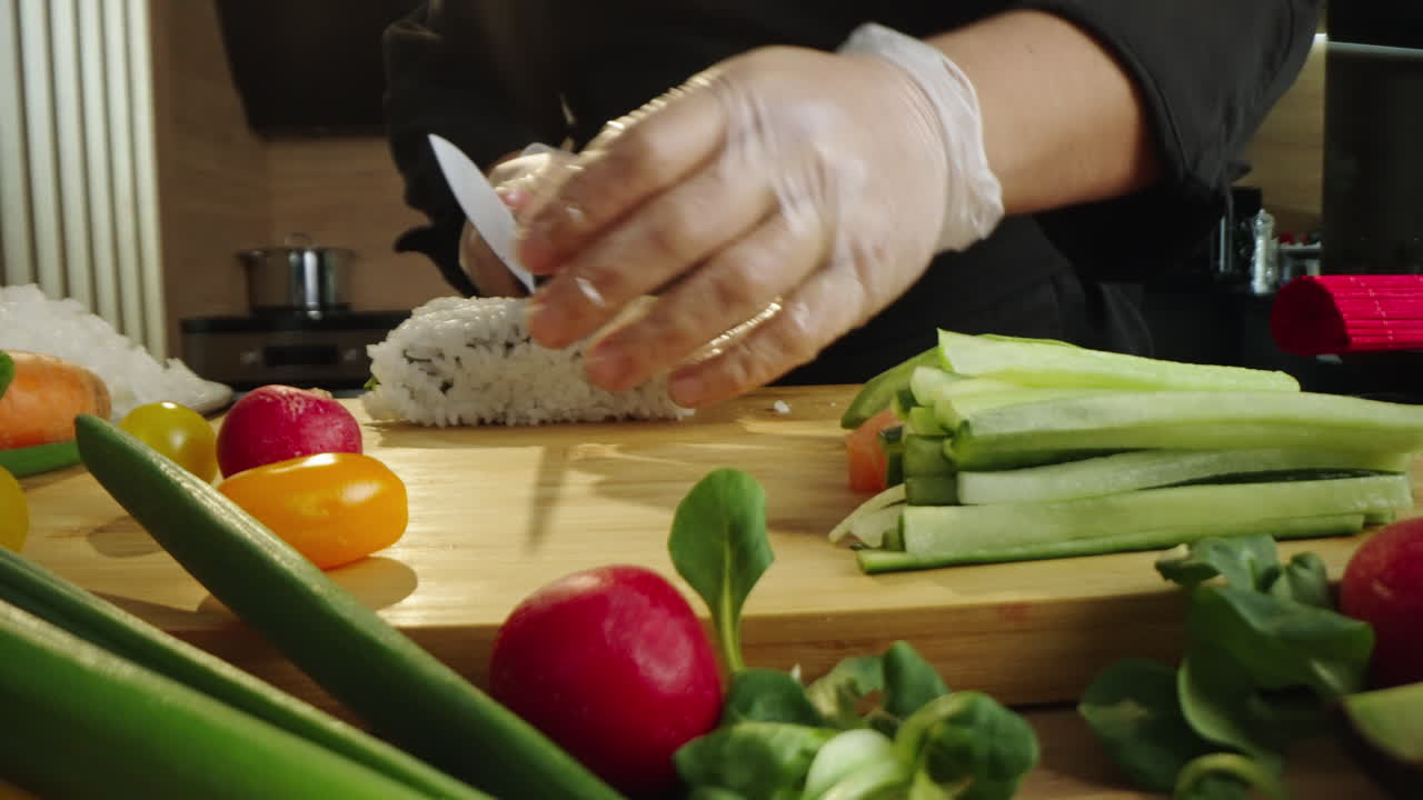 Chef Prepares Sushi Rolls with Fresh Ingredients