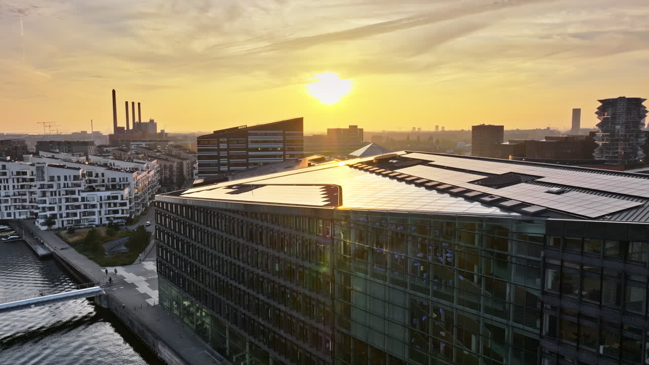 Aerial drone view of the Islands Brygge harbourfront area in central Copenhagen, Denmark at sunset