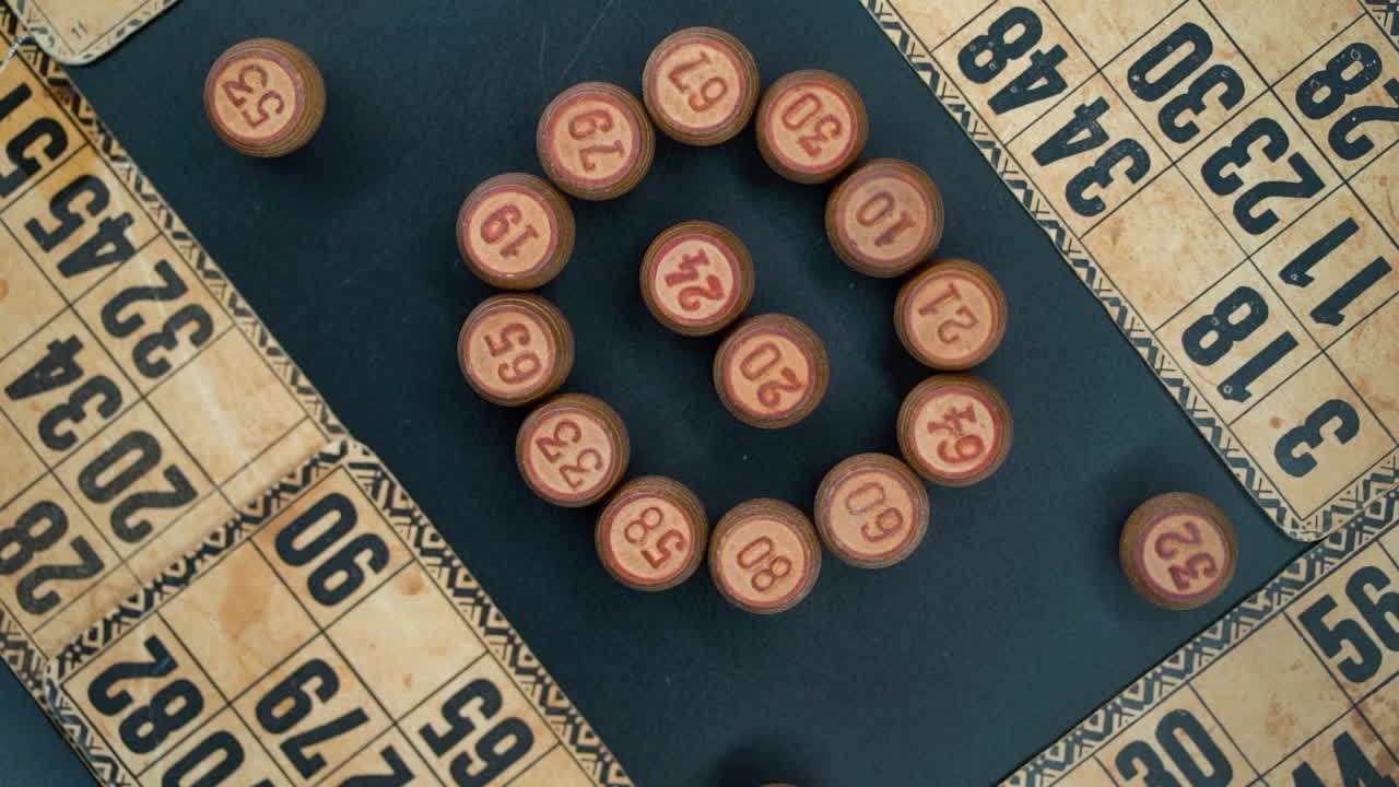 Creative close-up smooth zoom in rotating shot from above of a Bingo wooden barrels in a circle, woody figures, old numbers background, vintage board game, professional lighting, slow motion 120 fps
