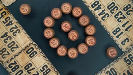 creative close-up smooth zoom in rotating shot from above of a bingo wooden barrels in a circle, woody figures, old numbers background, vintage board game, professional lighting, slow motion 120 fps