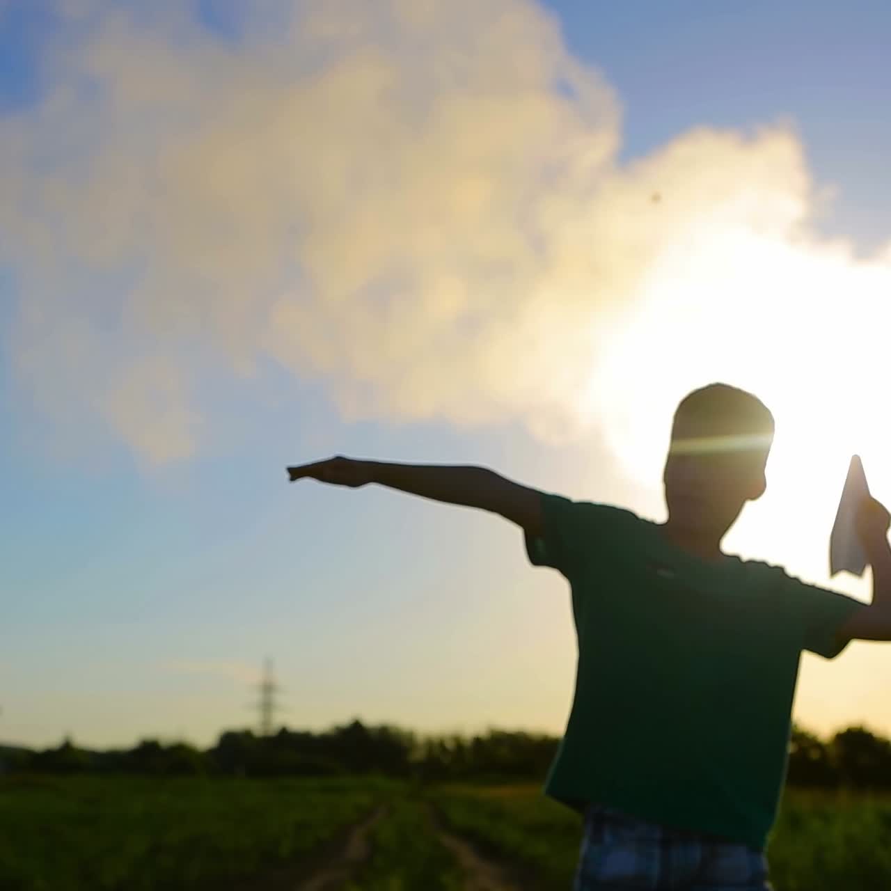 Young Boy Flying A Paper Plane