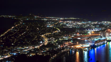 car lights randomly move through tauranga, new zealand, night timelapse from mount maunganui