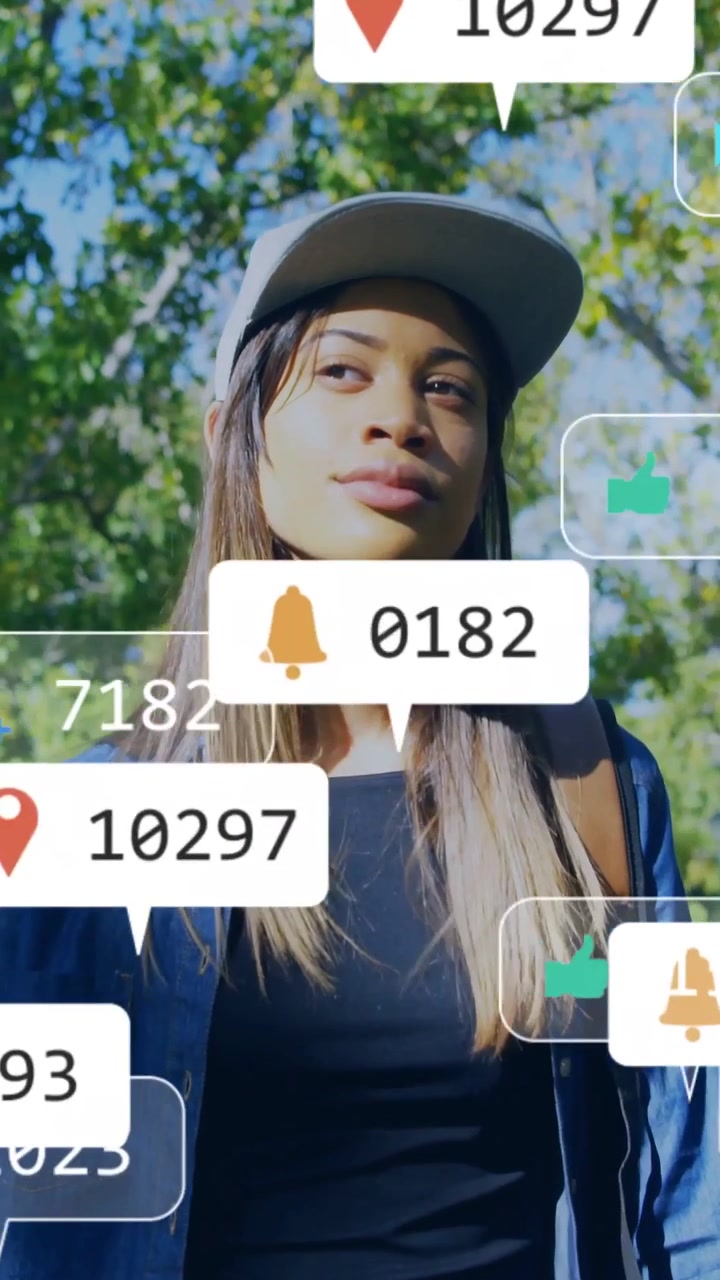 Sun hitting face causing woman walking in park eyes opening icons appearing and drifting as alerts