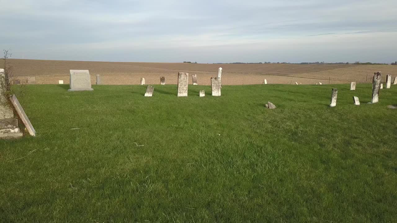 Aerial Drone Footage Of The Graves And Headstones In A Small, Country Cemetery Amidst The Cornfields Of Rural Iowa