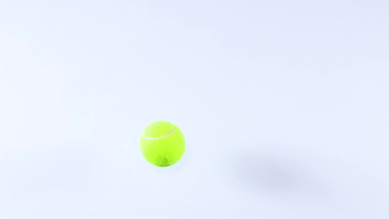 Tennis ball bouncing on a flat surface