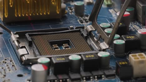 cpu processor socket being scanned by red laser, motherboard with electronic components, close up