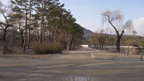 path by the gyeonghoeji pond within the gyeongbokgung palace in seoul, south korea. - wide shot