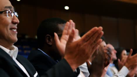 business executives applauding in a business meeting