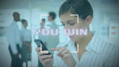 animation of you win text over caucasian businesswoman using smartphone