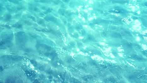 vista superior del mar azul tropical del caribe con fondo de efecto de textura, movimiento de olas del océano bucle sin costuras