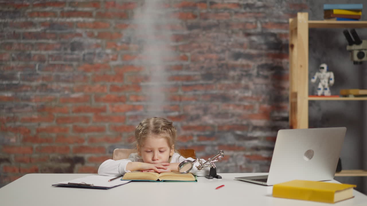 Tired little student with steam above head reads textbook