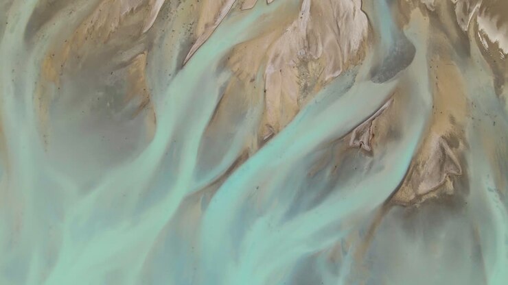 Beautiful river delta at head of glacial lake - aerial top down view