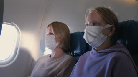 Passengers-of-the-aircraft-in-protective-masks-during-the-flight.-Protective-measures-during-the-covid-19-pandemic