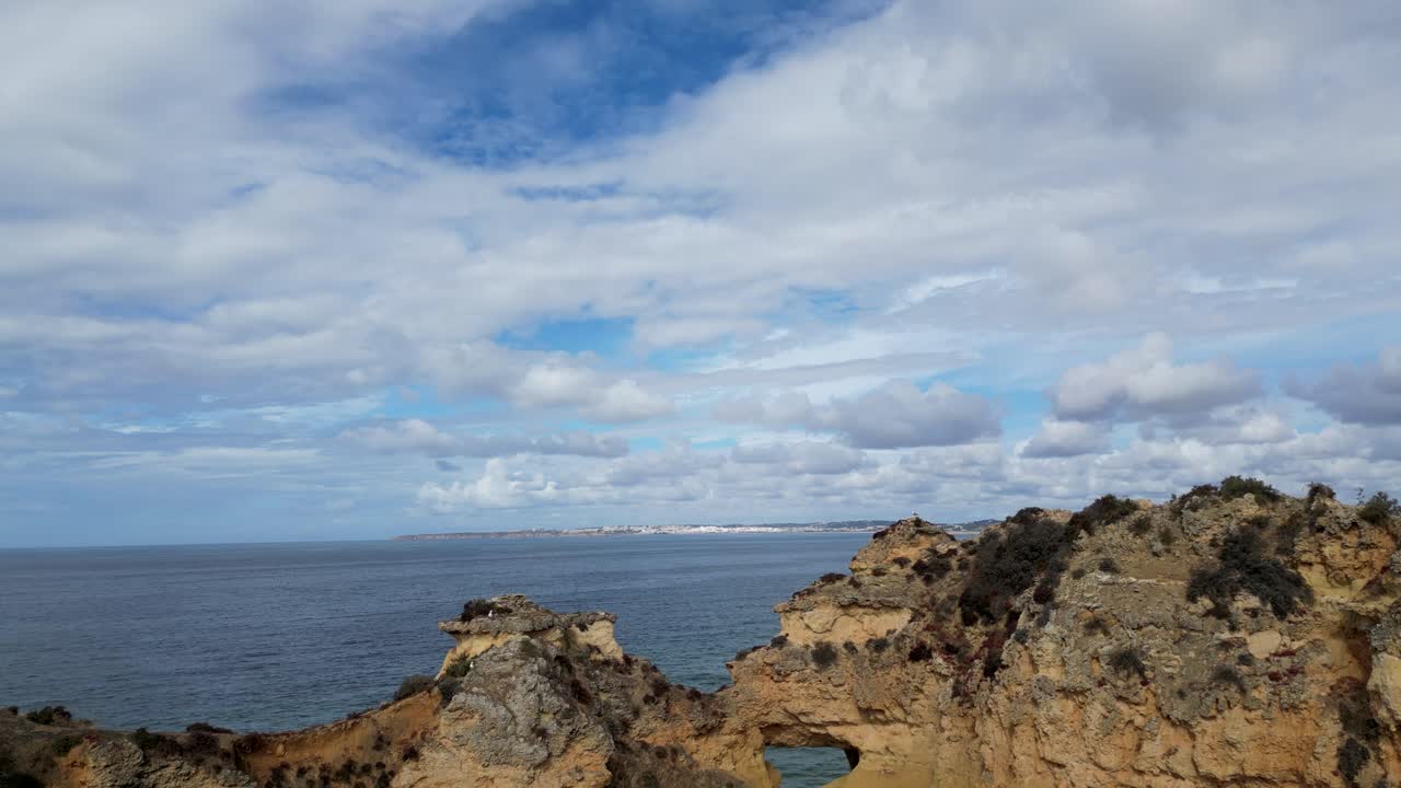 Portugal Algarve coastline, aerial drone view cloudy skyline Faro district