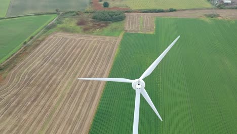 Slow-panning-shot-above-wind-turbine-in-British-countryside