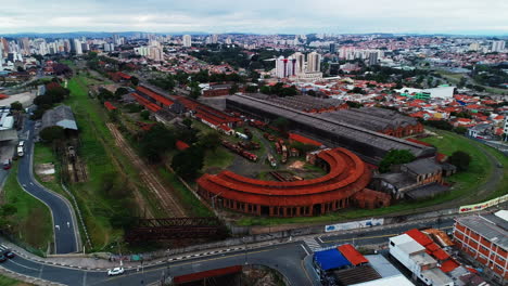 aerial video of an old train station in the city of campinas with abandoned wagons, brazil